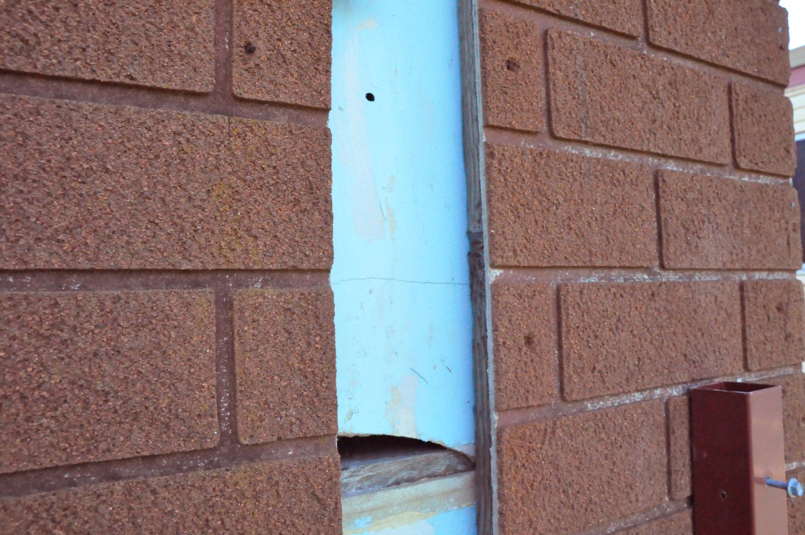Imitation brick cladding and asbestos Asbestos
